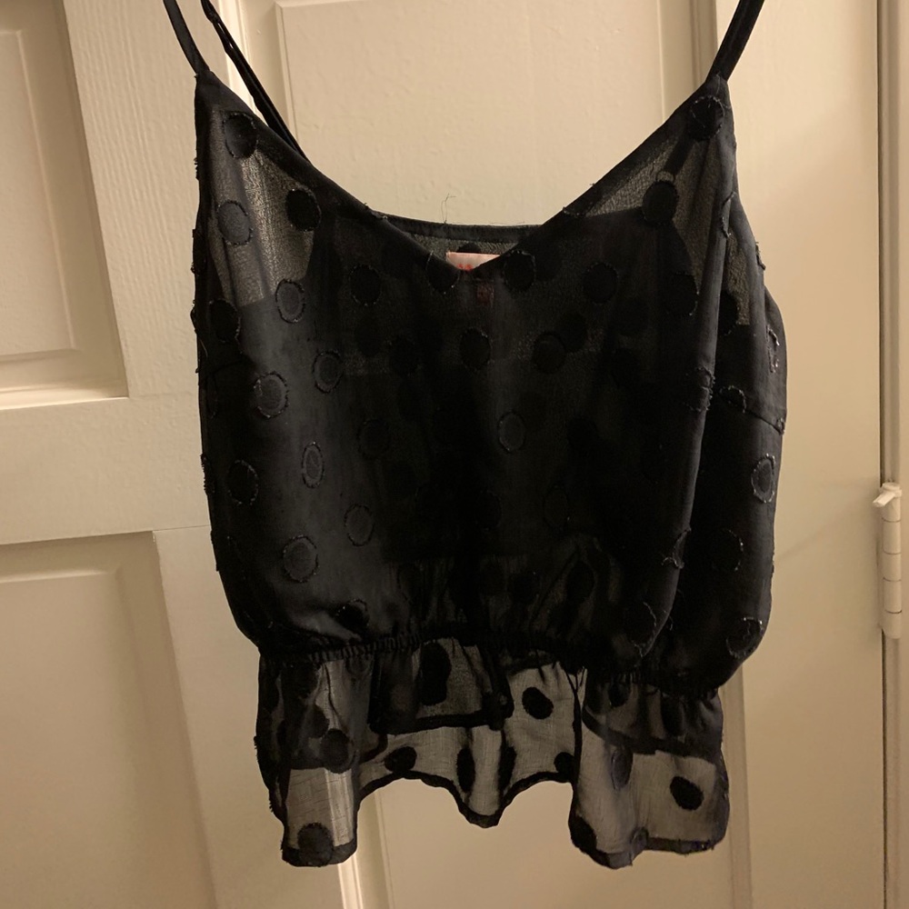 Black cropped polka dot shirt with ruffle bottom